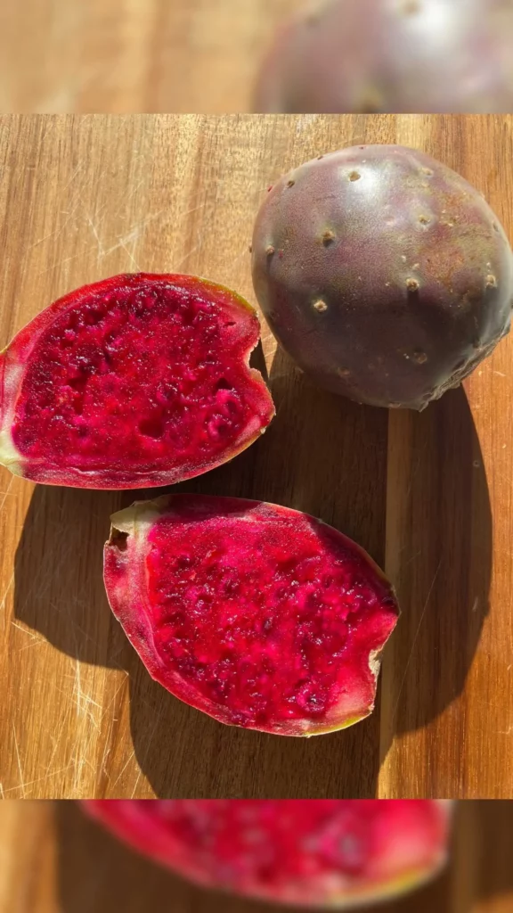Prickly Pear Cactus Fruit On Table In Dark Pink Color