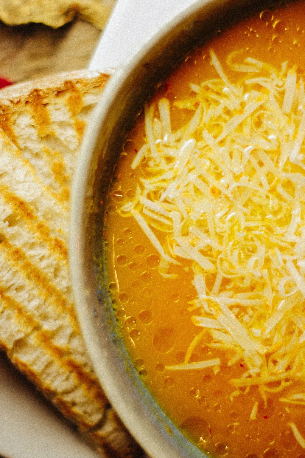 Close up of grilled cheese and tomato soup
