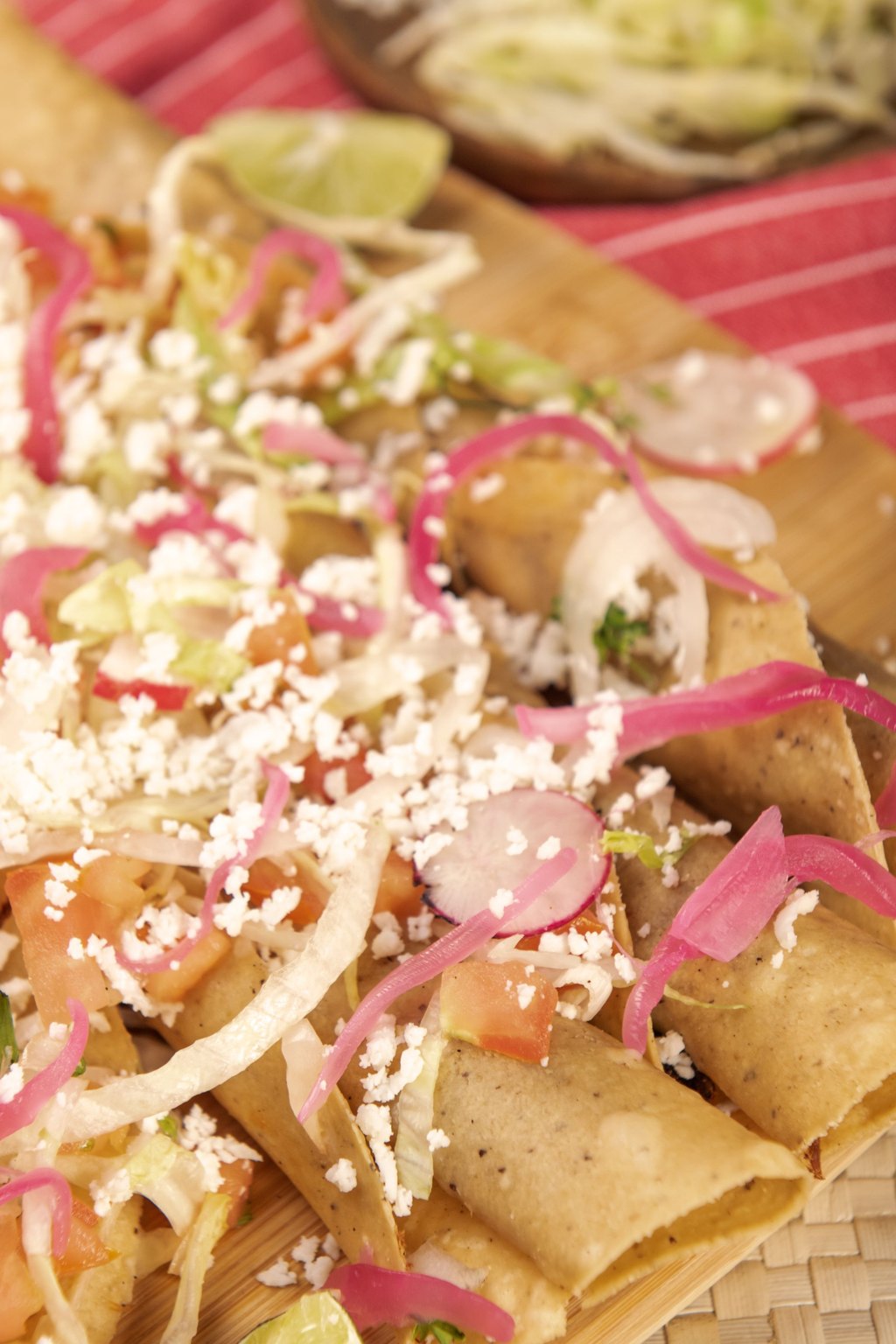 Close up of baked chicken taquitos
