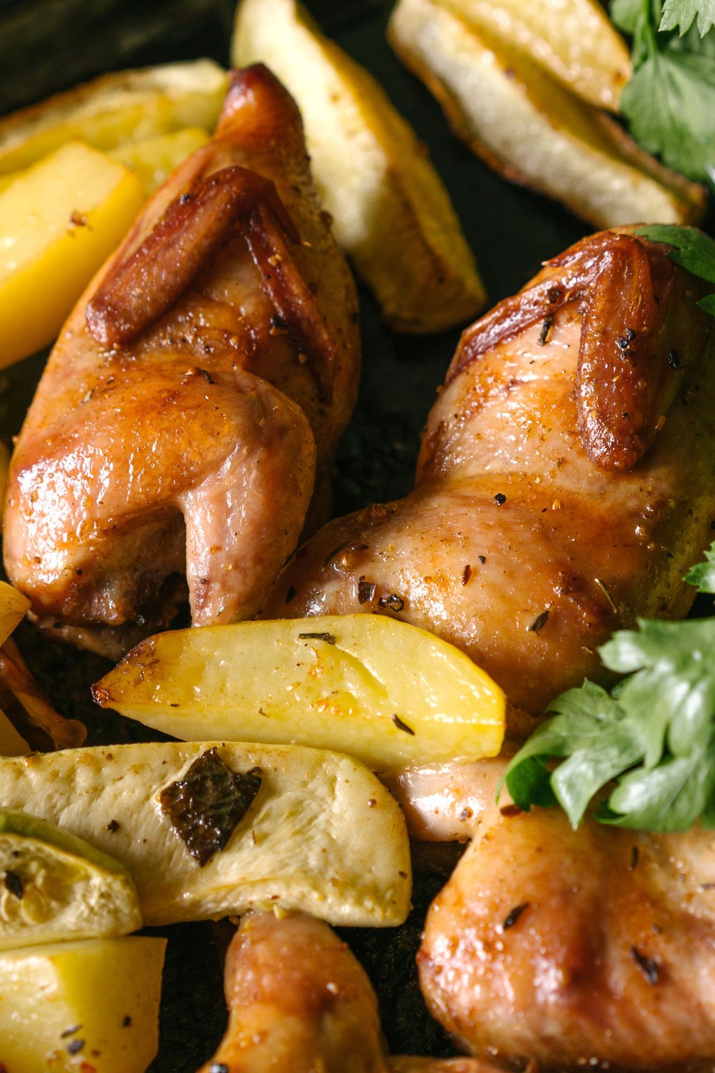Close up of sheet pan chicken thighs and potatoes