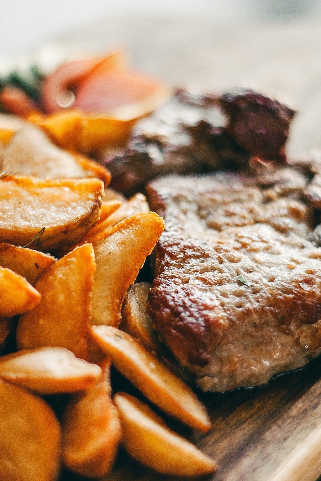 Close up of garlic butter steak bites and potatoes