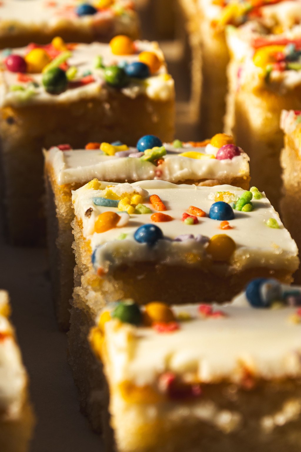 Close up of pumpkin bars with cream cheese frosting