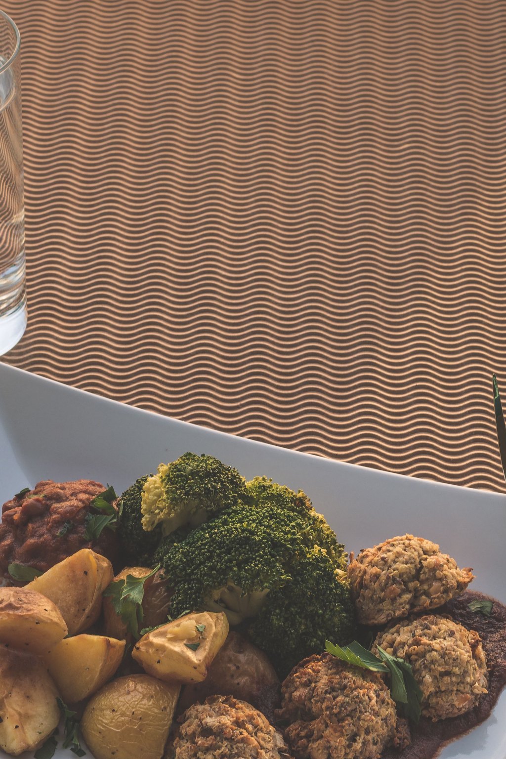 Close up of sheet pan turkey meatballs with broccoli
