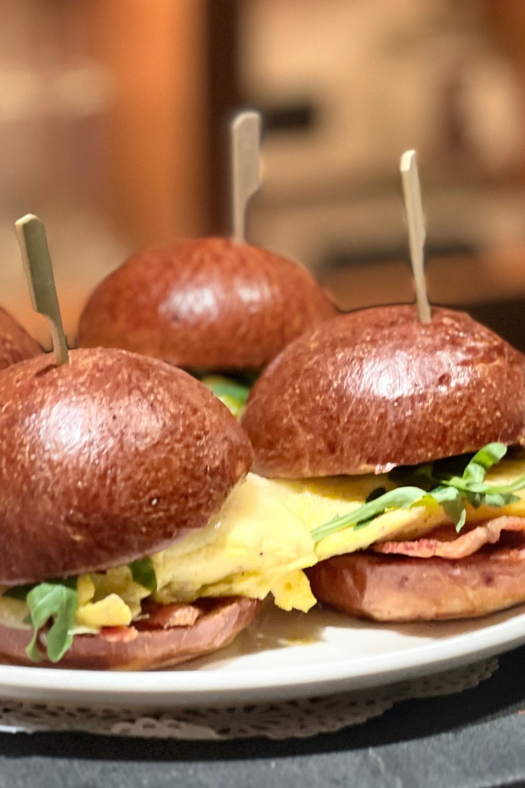 Close up of ham and swiss sliders